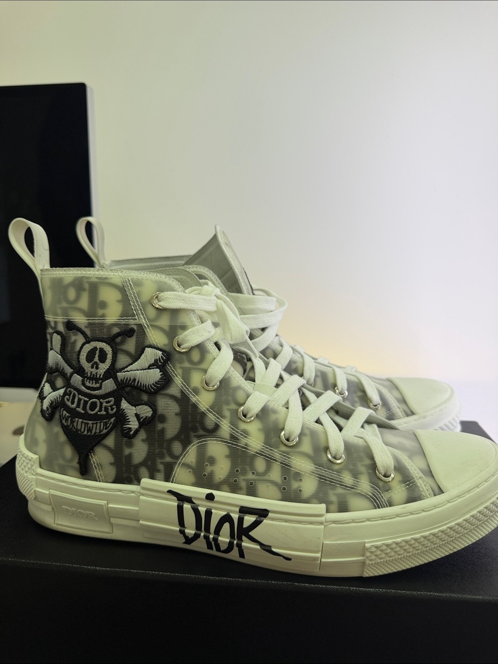 Dior Kids High-Top Sneaker in White and Black Graffiti